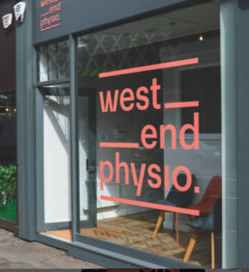 Front view of the West End Physio clinic with a large logo on the glass storefront